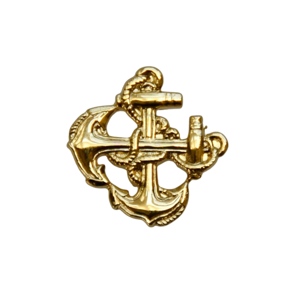 Gold anchor pin on a white background